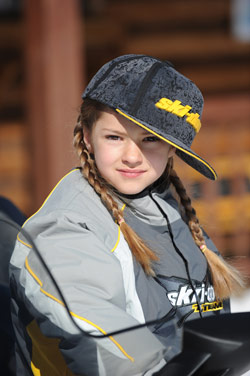 Young girl snowmobiling