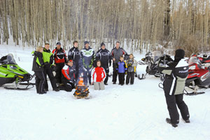 A group of snowmobilers