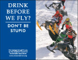 Horizontal Poster of Snowmobilers and text ‘Drink Alcohol Before We Fly? Don't Be Stupid'
