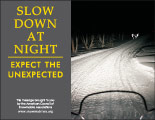 Horizontal Poster of Snowmobilers and text ‘Slow Down at Night. Expect the Unexpected'