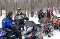 Snowmobilers chatting