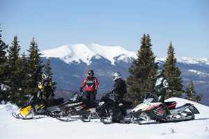 Snowmobiling along a beautiful vista