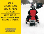 Horizontal Poster of Snowmobilers and text ‘Use Caution on Open Roads. Keep Right. Ride Single File. Reduce Speed.'